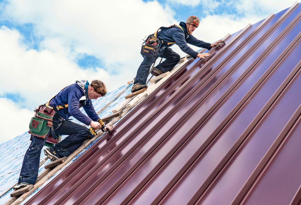 workers installing roof in tallahassee